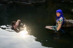 DM mermaid Symone sit in water